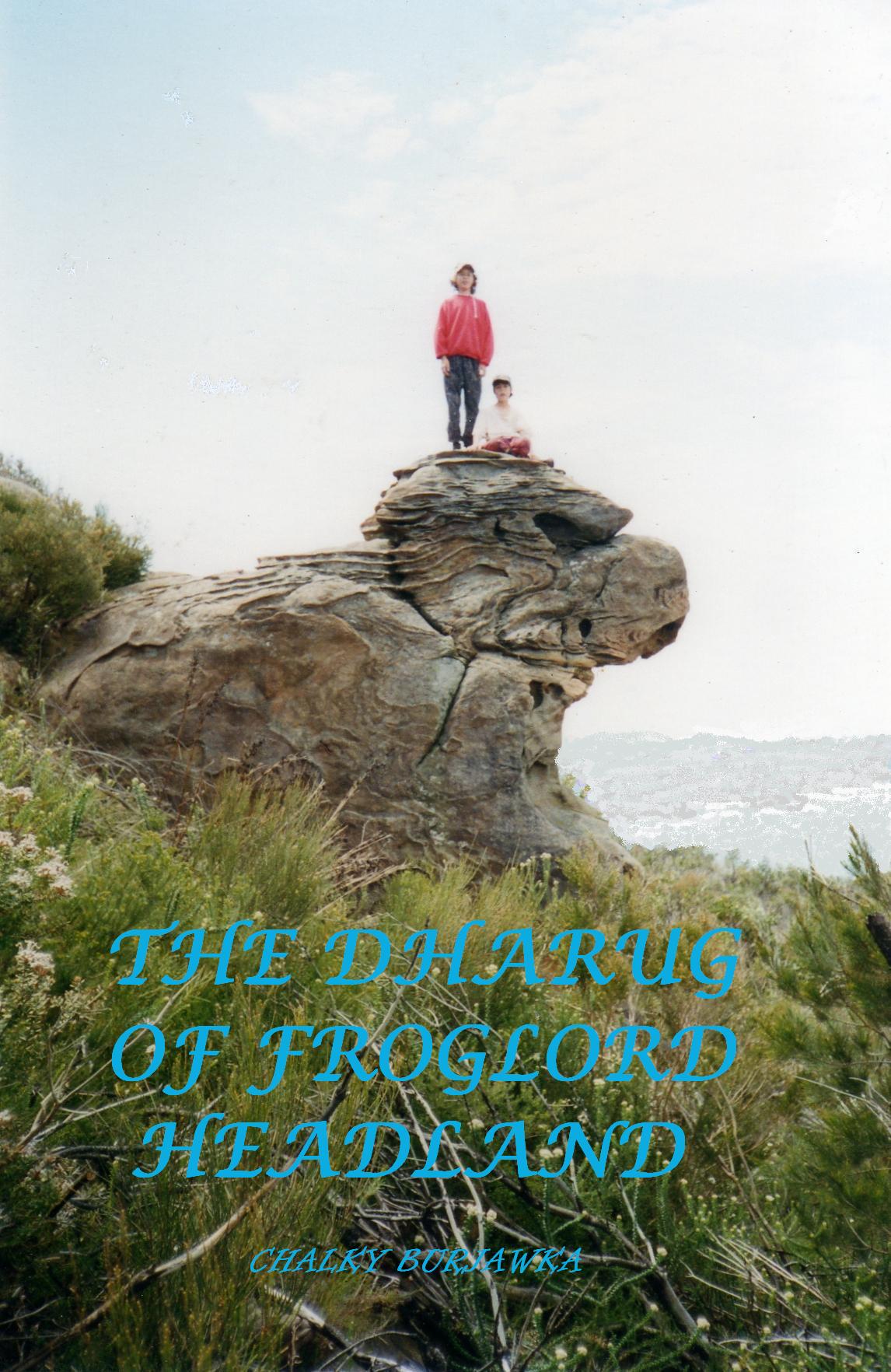 A book cover for 'The Dharug of Froglord Headland' by Chalky Boshawks, featuring a photograph of two people standing on a large rock formation with green vegetation in the foreground and a hazy sky above.

